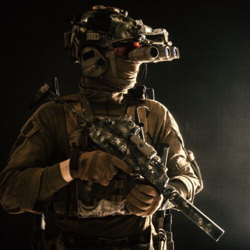 Soldier with Tactical Gear on Black Backdrop